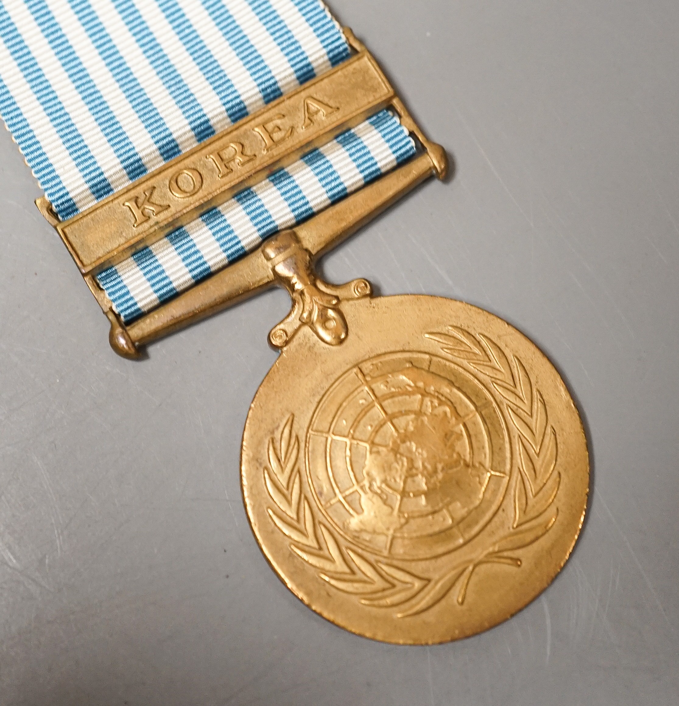 Four military medals - Korea medal to A. J. de Courcy Harrison, UN Korea medal, a George VI Cadet Forces medal and a GSM with Palestine clasp to 14158929 PTE. J. SANDERSON. A.C.C.